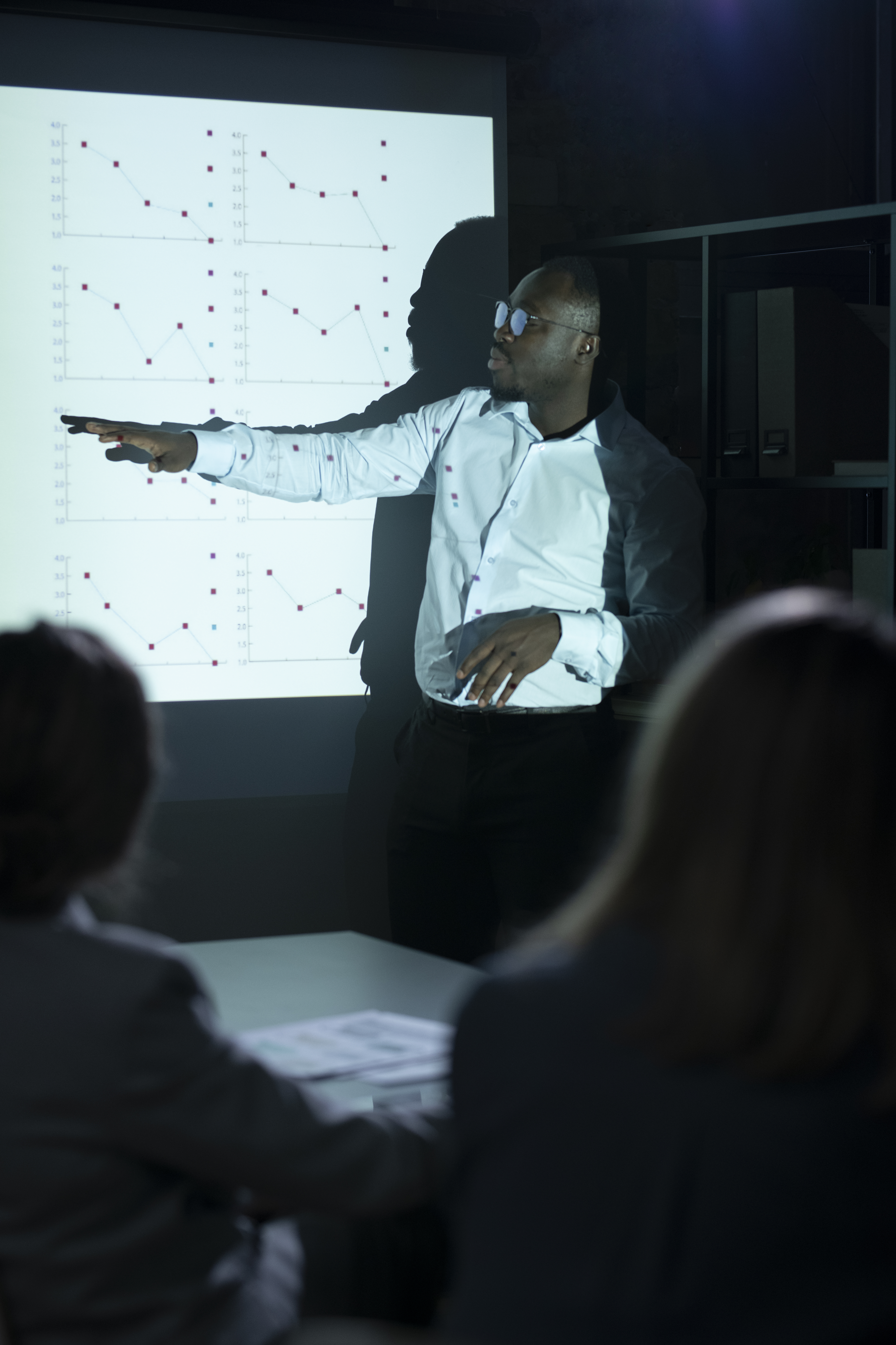 black-man-giving-presentation-meeting